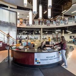 Student checking at the Student Recreation Center desk.