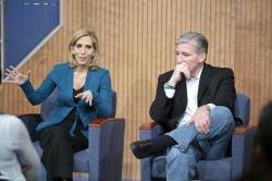 Dana Bash answers a question as John King listens.